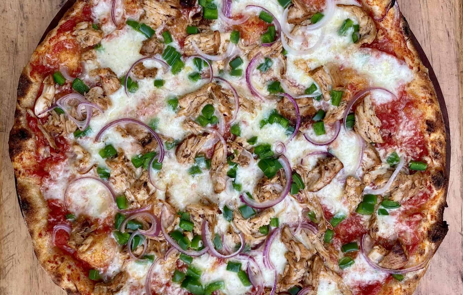 PULLED CHICKEN + CRISPY VEG – Delicately spiced, grilled and pulled local chicken with fresh and crispy green peppers and red onions.